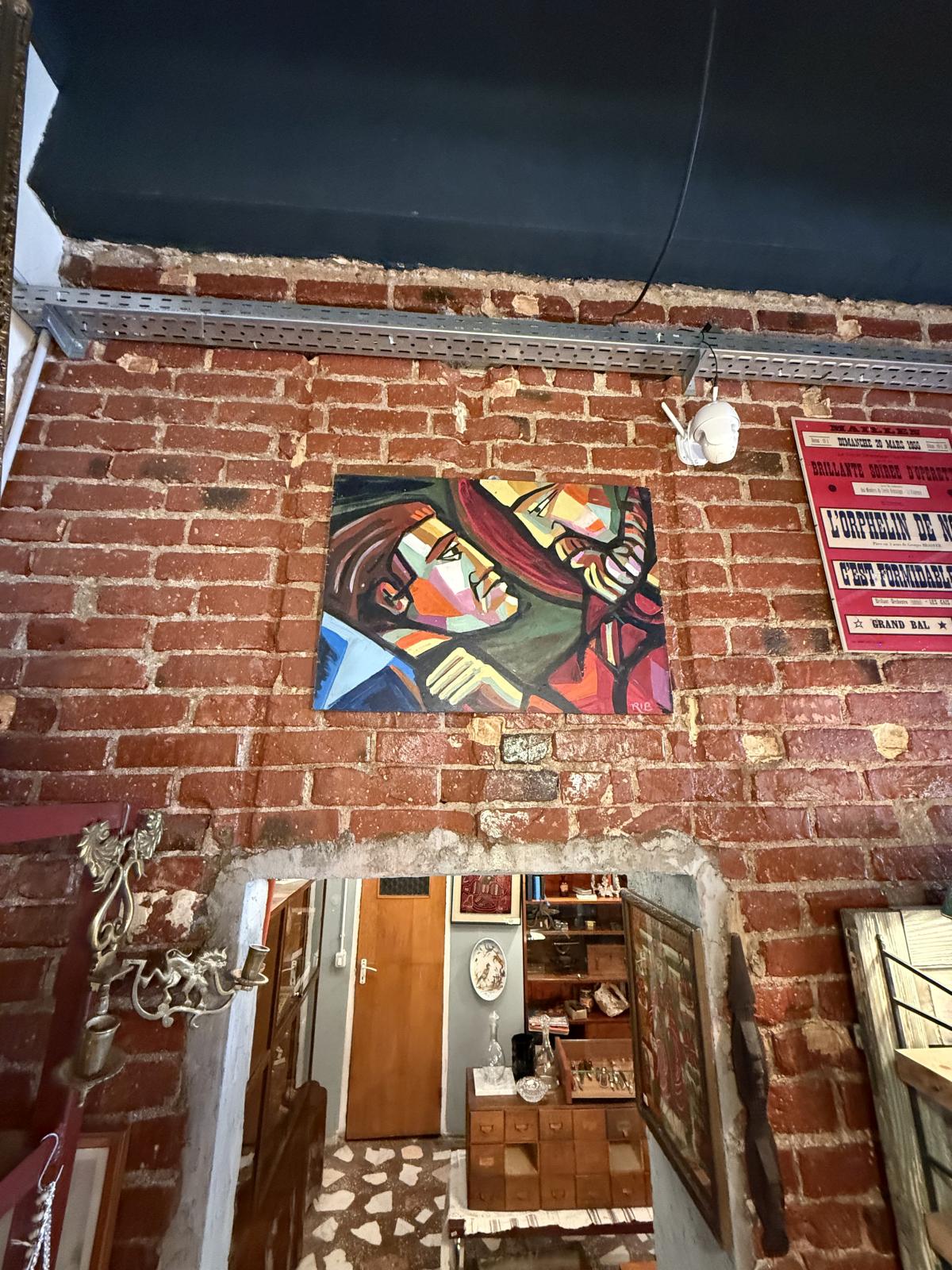 Pictură modernistă pe panou din lemn, semnată RIB, cu două personaje redate într-o compoziție cu influențe cubiste. bucuresti